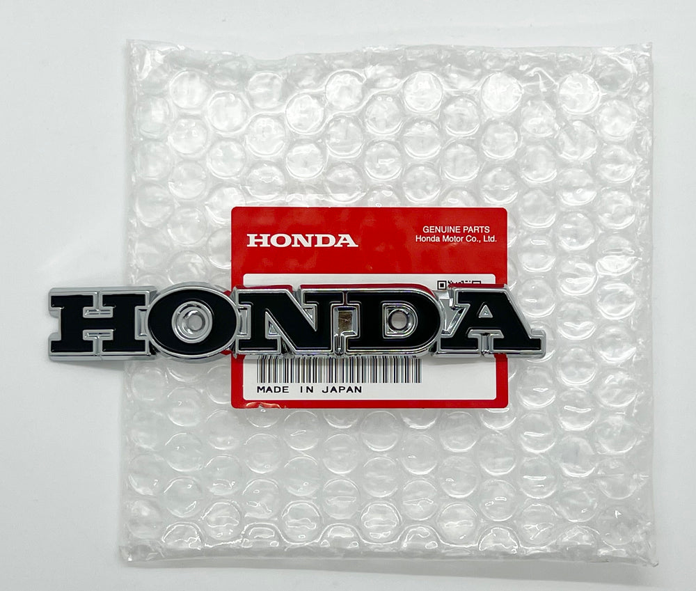 NOS oem Honda badge (black) 1970-71 US90 # 87123-918-000